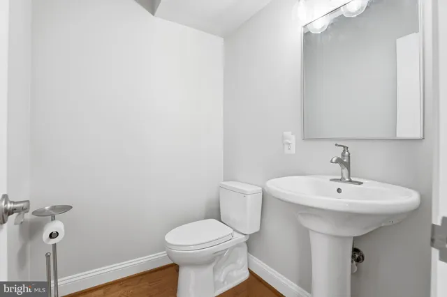 a view of a kitchen with furniture and large windows