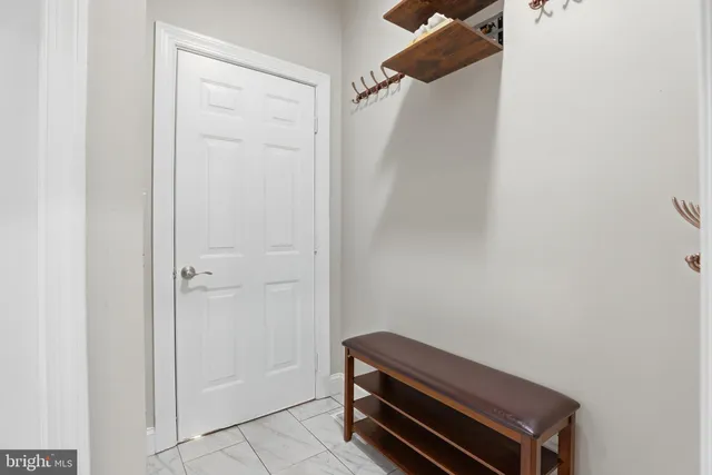 a kitchen with a refrigerator and a sink