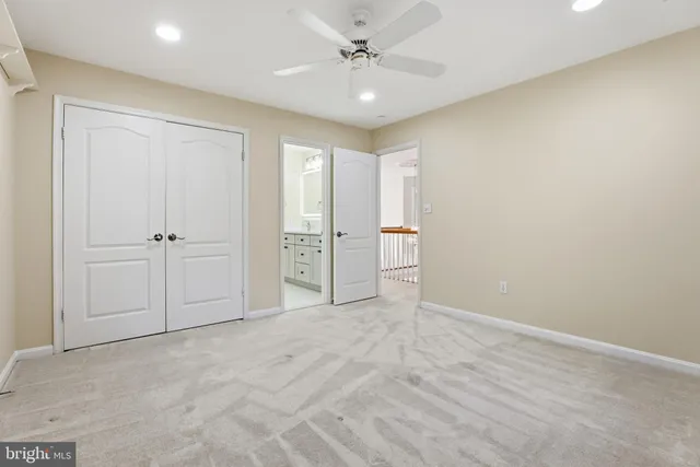 a bathroom with a granite countertop toilet a sink and a bathtub
