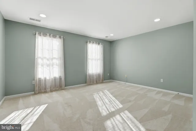 a bathroom with a shower sink vanity and mirror