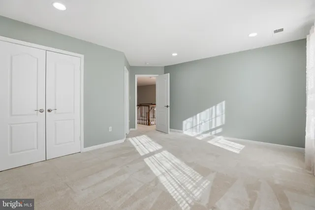 a view of a hallway with wooden shelves