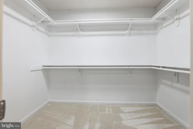 a view of an empty room with a chandelier