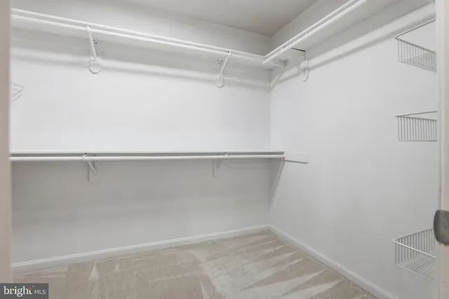 a spacious bathroom with a tub sink and mirror