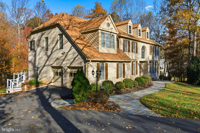 a view of a brick house with potted plants