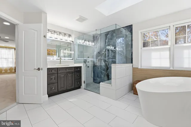 a media room with lots of chairs and a projector screen