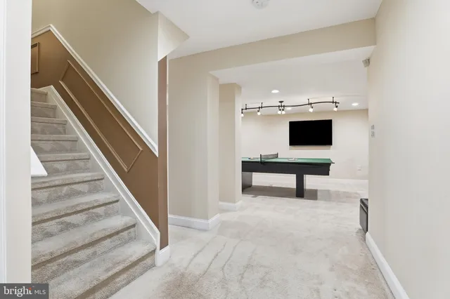 a view of a balcony with wooden floor and fence