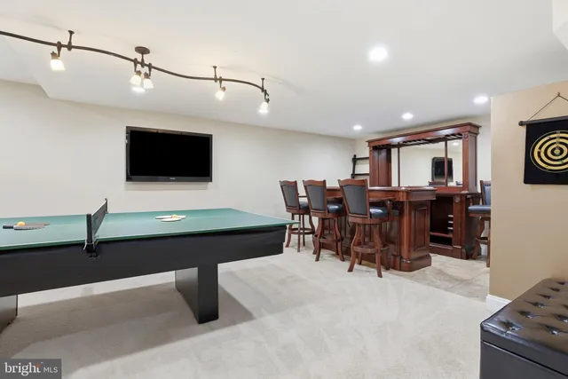 a view of house with backyard and sitting area