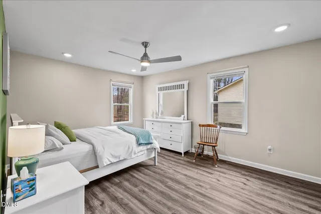 a bed room with a bed and a window