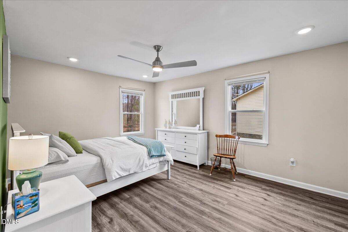 513 Broad Street Roxboro, NC 27573 - Photo 14 of 33 a bed room with a bed and a window