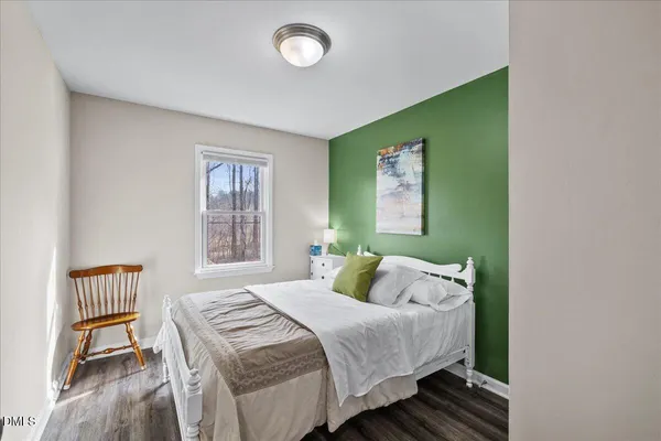 a bedroom with a bed and pillows