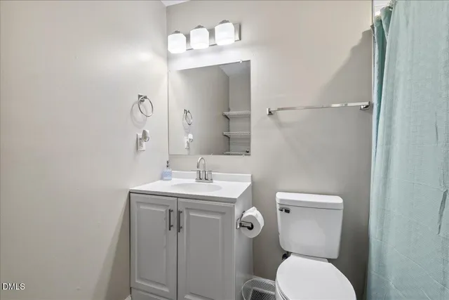 a bathroom with a shower and a toilet