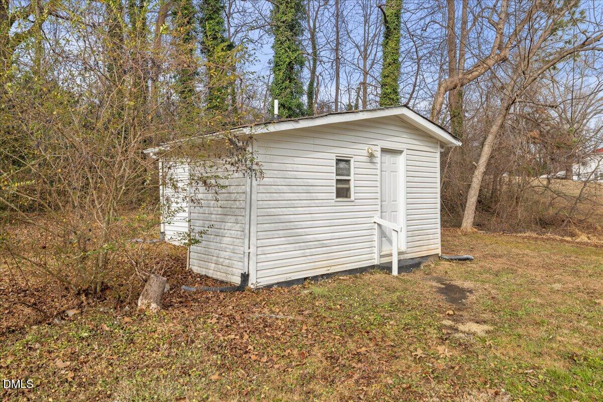 513 Broad Street Roxboro, NC 27573 - Photo 30 of 33 a view of a house with a yard
