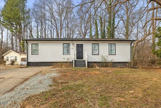a house with yard in front of it