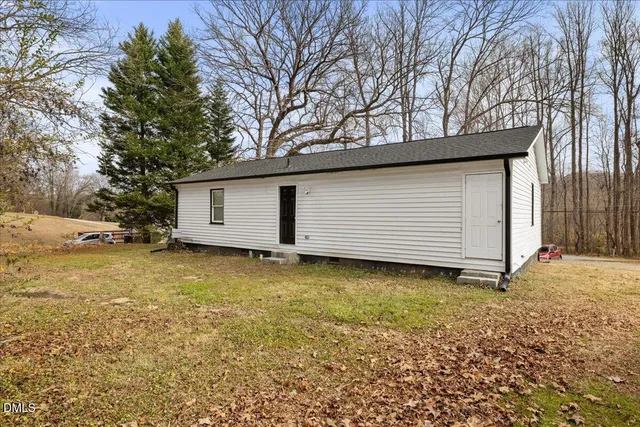 a backyard of a house with garage