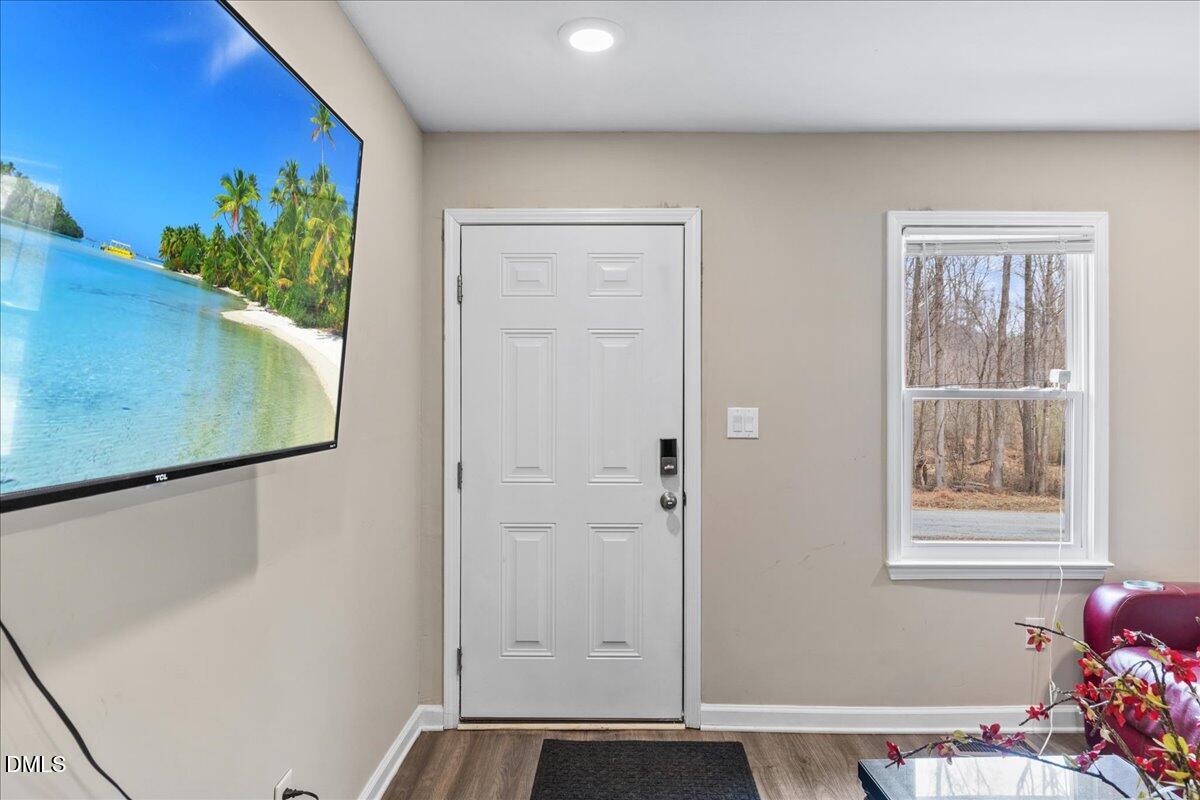 513 Broad Street Roxboro, NC 27573 - Photo 4 of 33 a view of an entryway with wooden floor