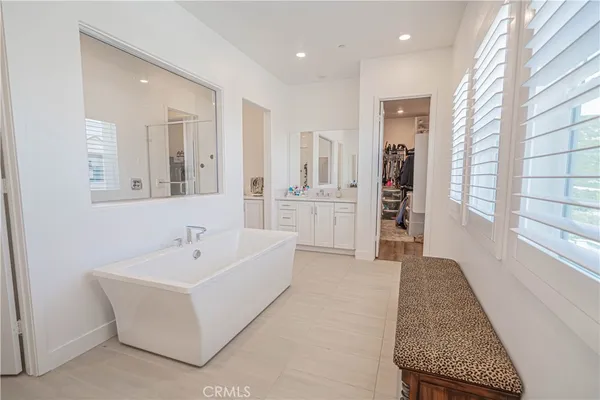 a bathroom with a shower and a mirror