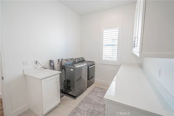 a white toilet sitting next to a bathroom