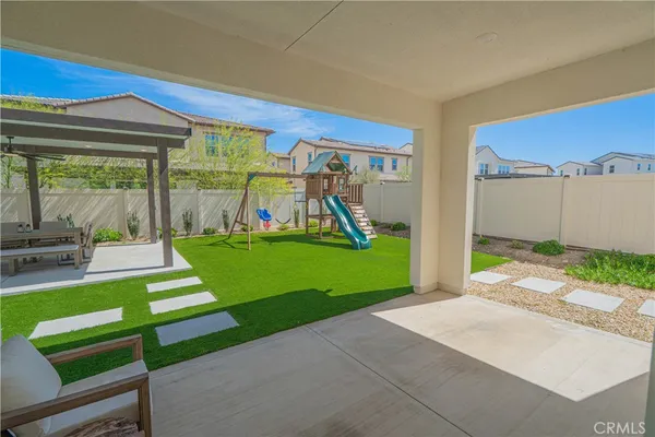 a view of yard with patio