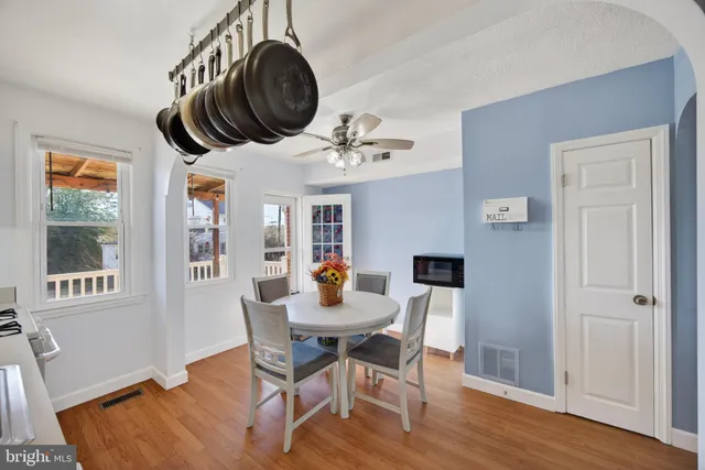 a dining room with furniture and window