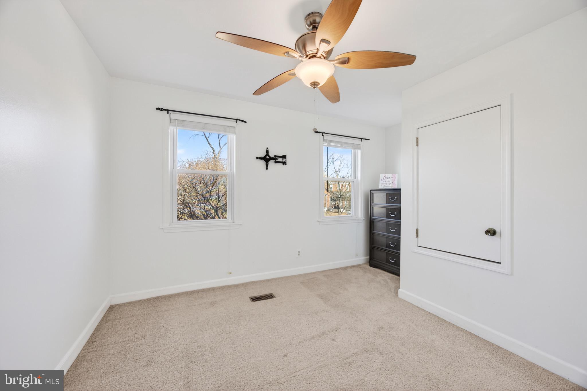3579 Benzinger Road Baltimore, MD 21229 - Photo 22 of 34 an empty room with fan and windows