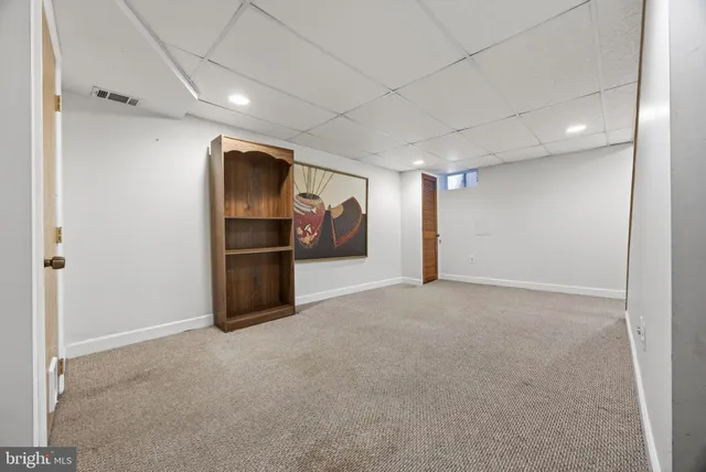 a view of an empty room with stairs
