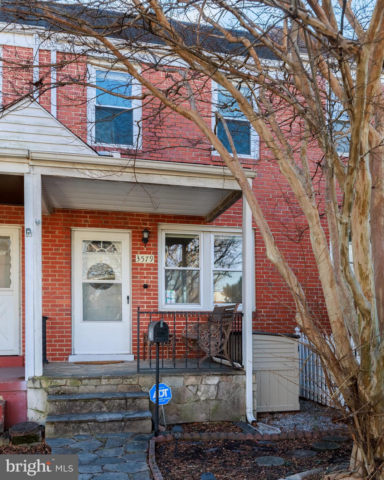 3579 Benzinger Road Baltimore, MD 21229 - Photo 3 of 34 a front view of a house with a tree