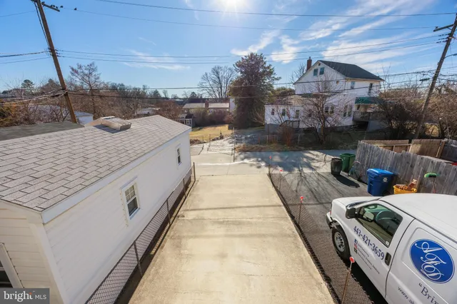 a view of a building with car parked