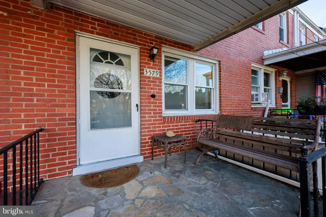 a view of a house with a bench