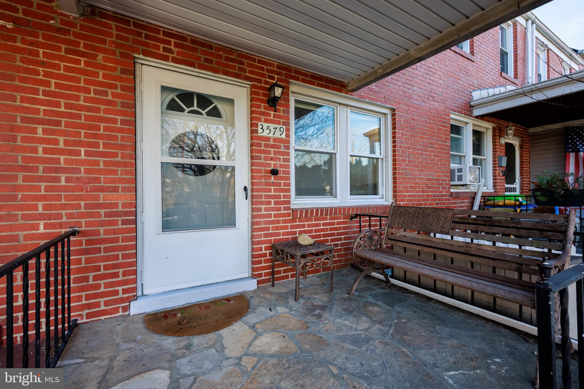 3579 Benzinger Road Baltimore, MD 21229 - Photo 4 of 34 a view of a house with a bench