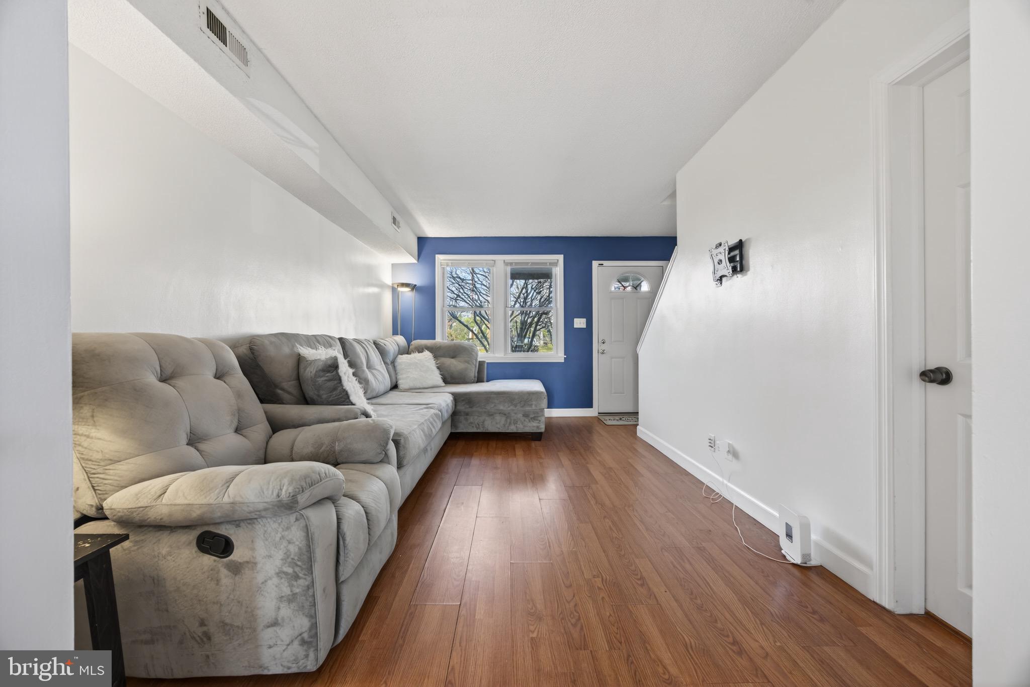 3579 Benzinger Road Baltimore, MD 21229 - Photo 8 of 34 a living room with furniture and a window