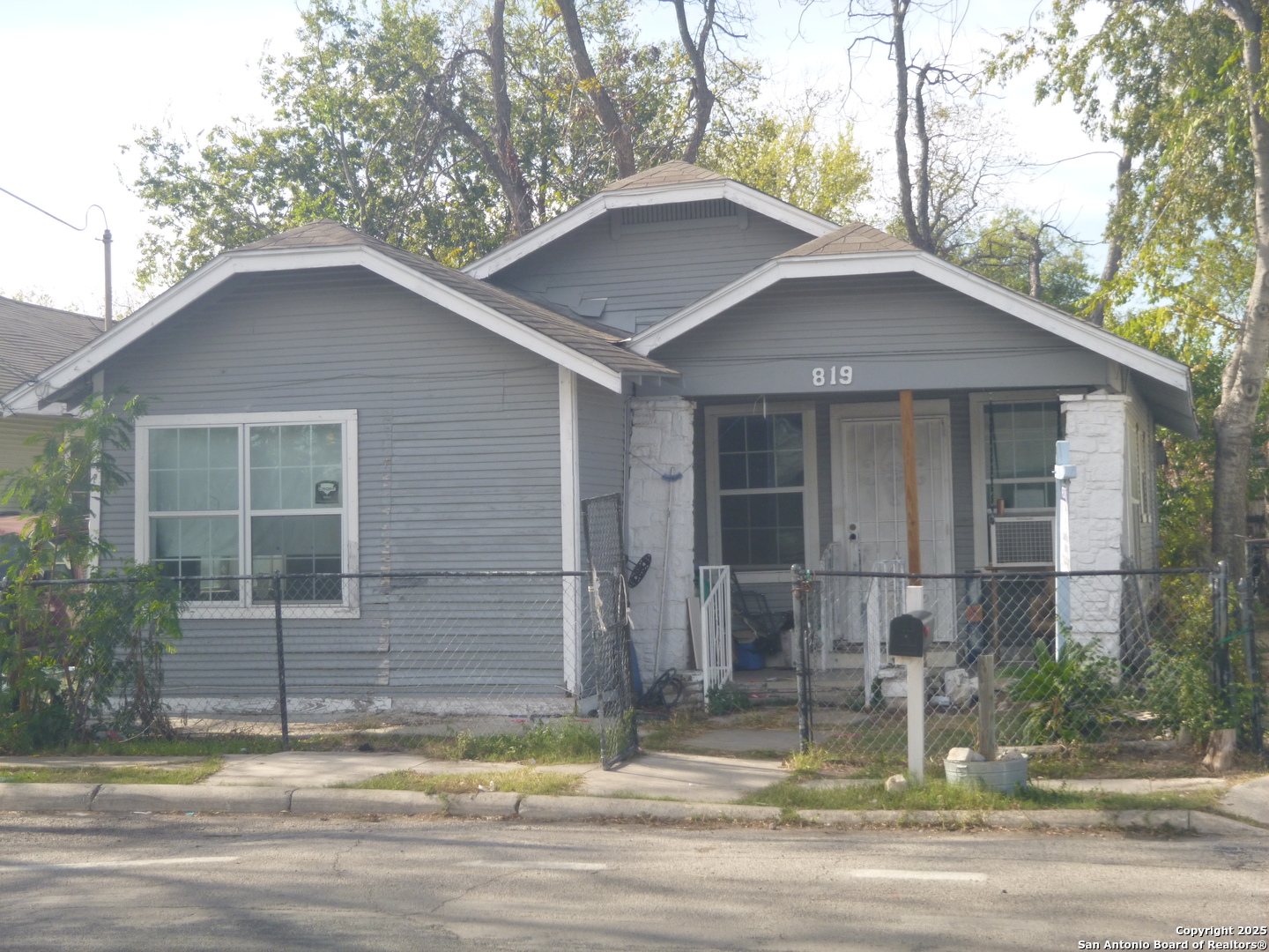 819 North Hamilton Avenue San Antonio, TX 78207 - Photo 1 of 8 a view of a house with a yard plants and large tree