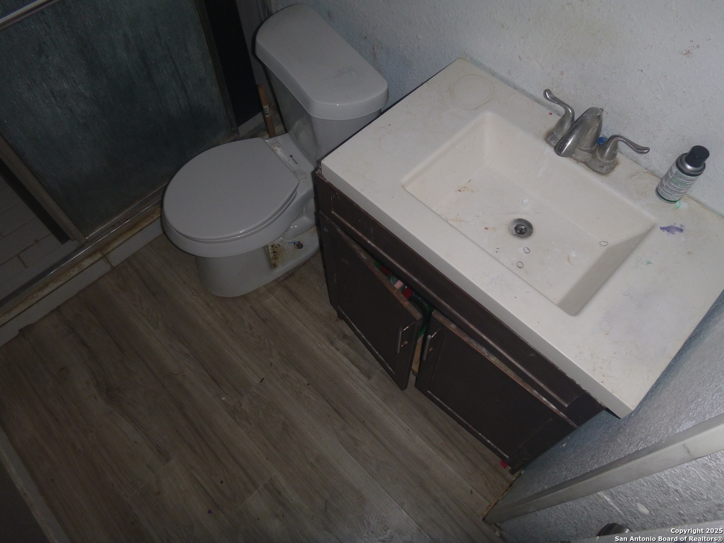 819 North Hamilton Avenue San Antonio, TX 78207 - Photo 7 of 8 a white toilet sitting next to a bathroom sink