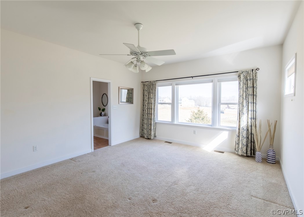 1210 Schroeder Road Powhatan, VA 23139 - Photo 21 of 50 PRIMARY SUITE VIEWS WITH CARPET, LARGE WINDOWS AND