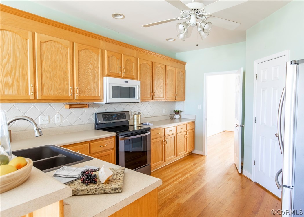 1210 Schroeder Road Powhatan, VA 23139 - Photo 9 of 50 KITCHEN VIEWS WITH HARDWOOD FLOORS, TILE BACKSPLAS
