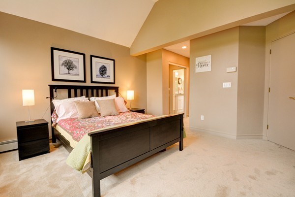 149 Nourse Road Bolton, MA 01740 - Photo 16 of 30 a bedroom with a bed and paintings on the wall