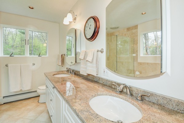149 Nourse Road Bolton, MA 01740 - Photo 18 of 30 a bathroom with a granite countertop sink and a mirror