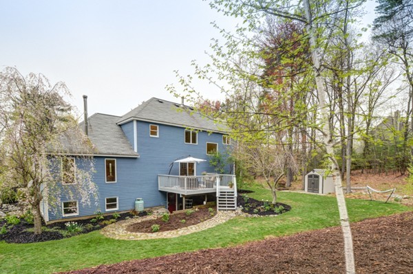 149 Nourse Road Bolton, MA 01740 - Photo 28 of 30 a view of a house with a yard and sitting area
