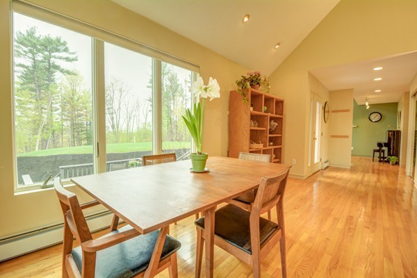 149 Nourse Road Bolton, MA 01740 - Photo 4 of 30 a view of a dining room with furniture and wooden floor