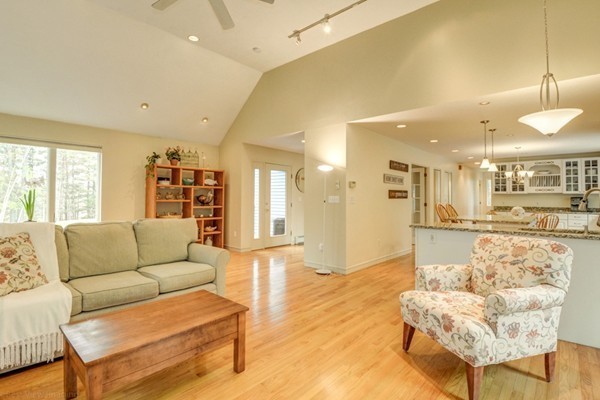 149 Nourse Road Bolton, MA 01740 - Photo 6 of 30 a living room with furniture and a large window with kitchen view