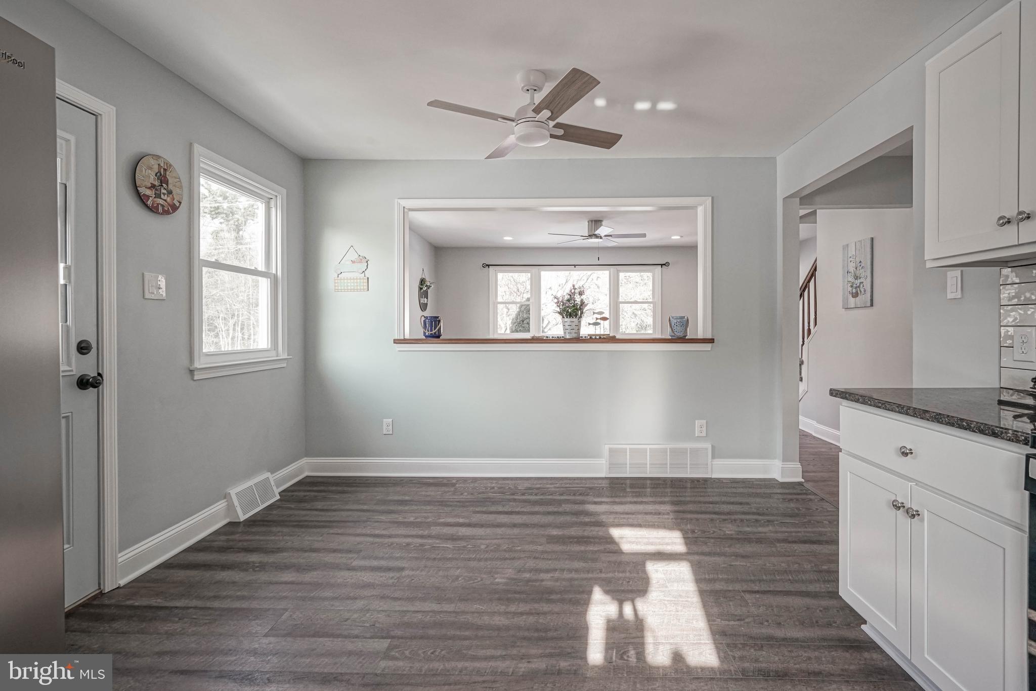 8 Riviera Drive Pennsville, NJ 08070 - Photo 13 of 31 a view of a kitchen with wooden floor and a window