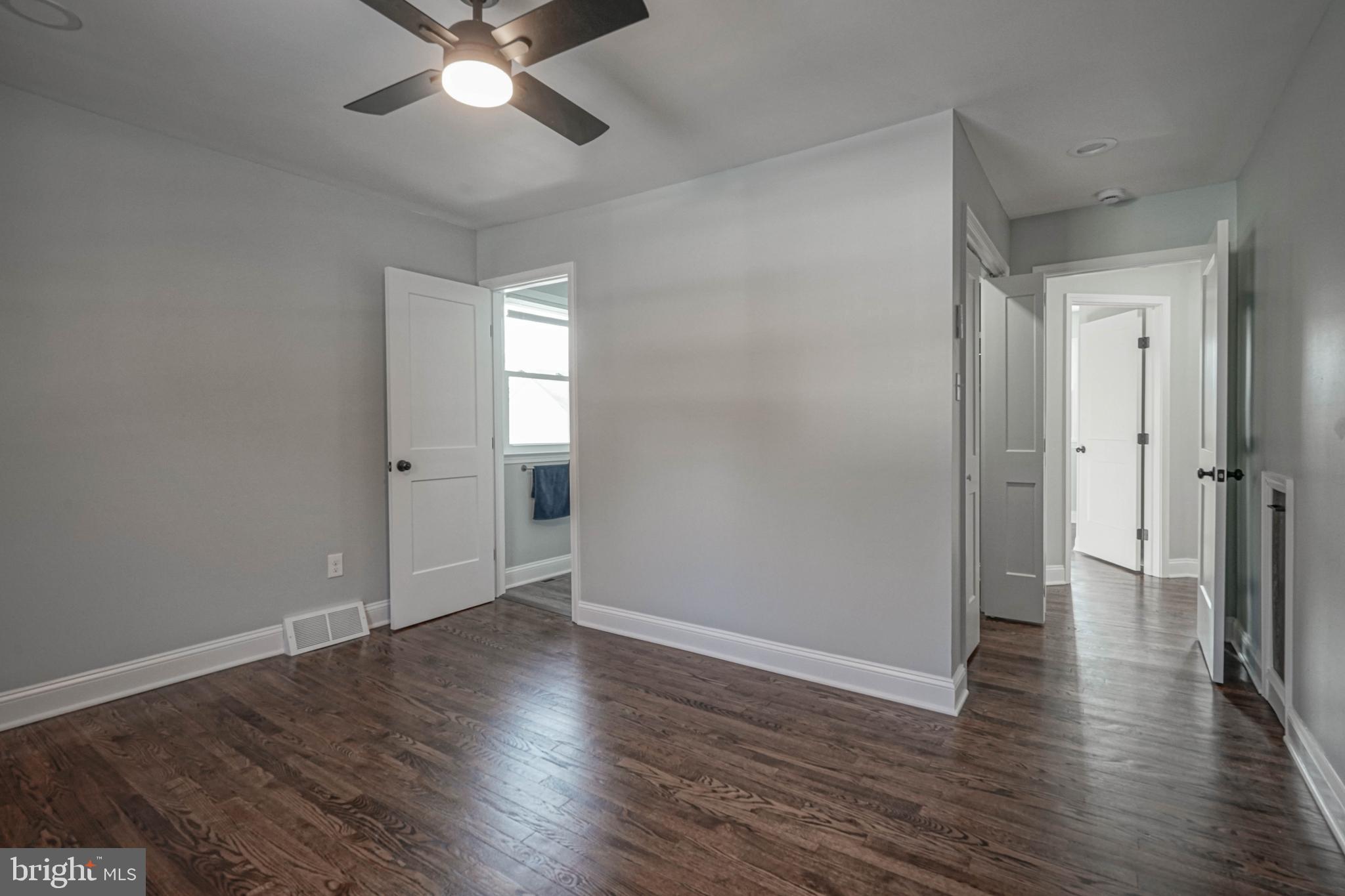 8 Riviera Drive Pennsville, NJ 08070 - Photo 16 of 31 an empty room with wooden floor and a ceiling fan
