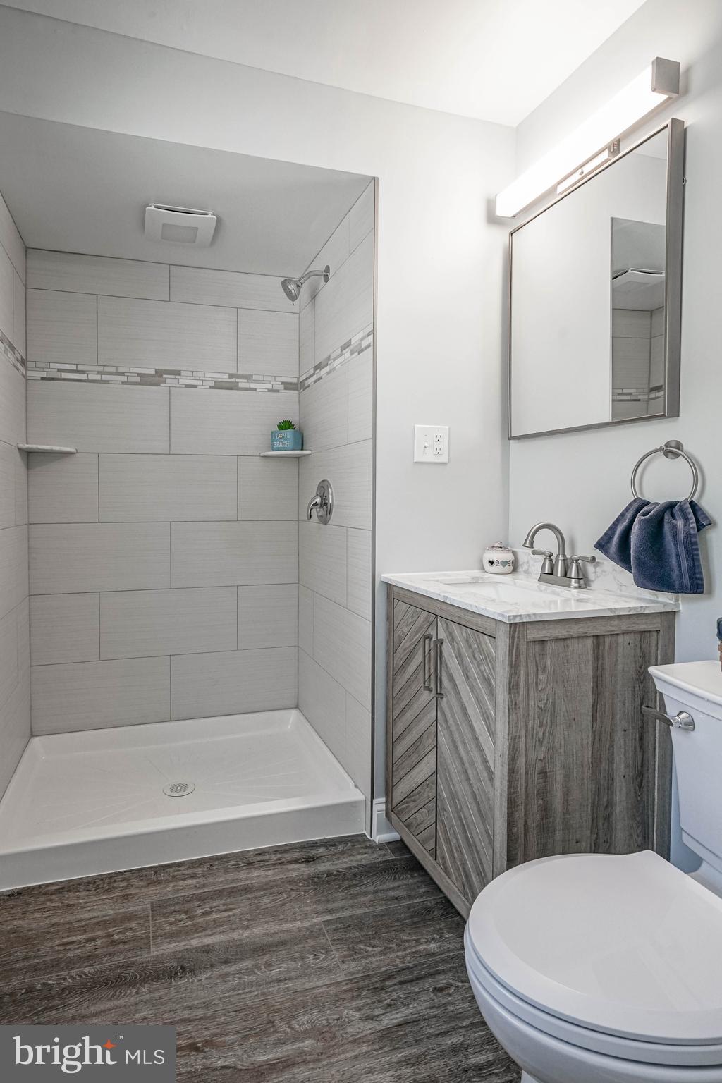 8 Riviera Drive Pennsville, NJ 08070 - Photo 20 of 31 a bathroom with a sink a toilet and shower