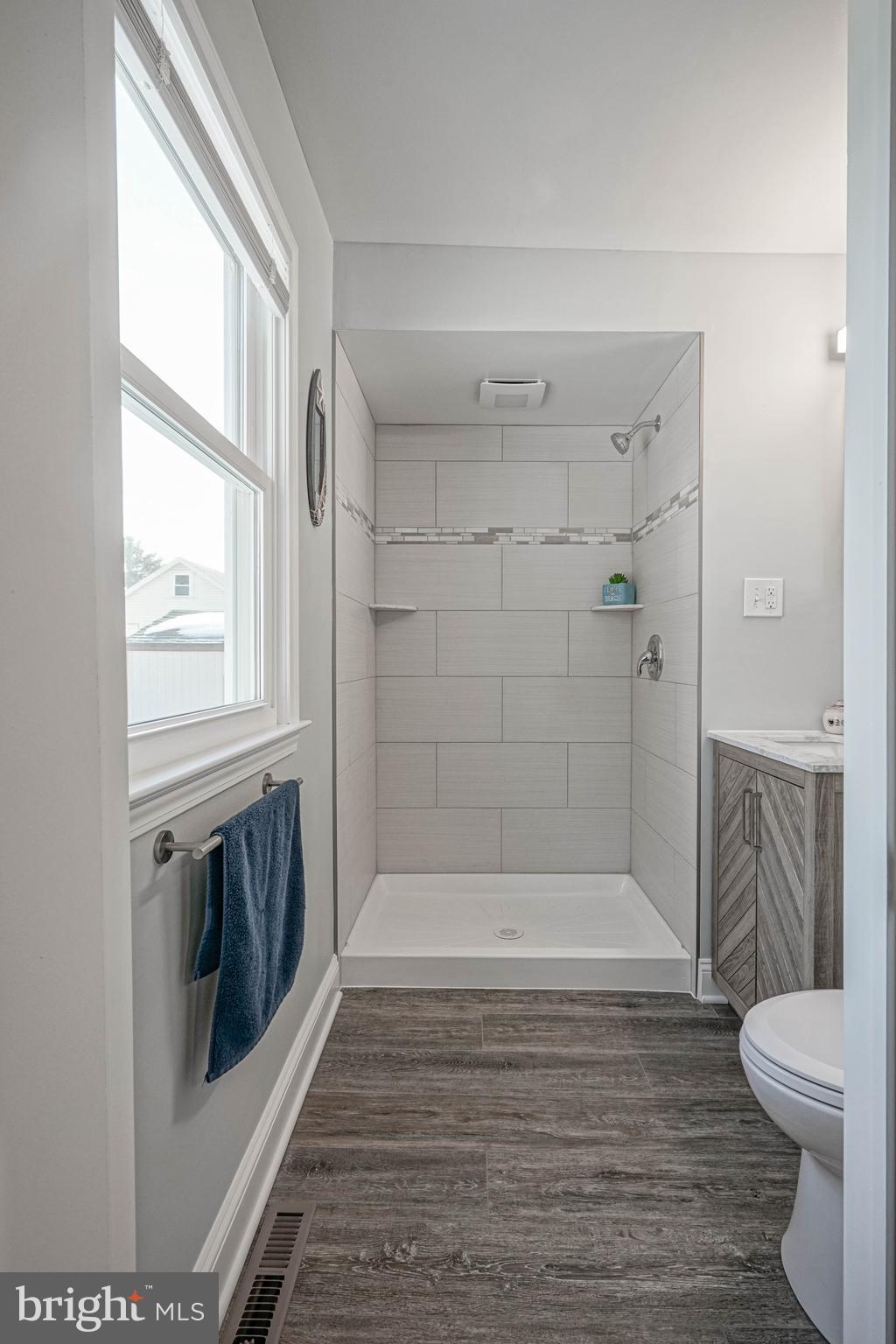 8 Riviera Drive Pennsville, NJ 08070 - Photo 21 of 31 a bathroom with a sink a toilet and shower
