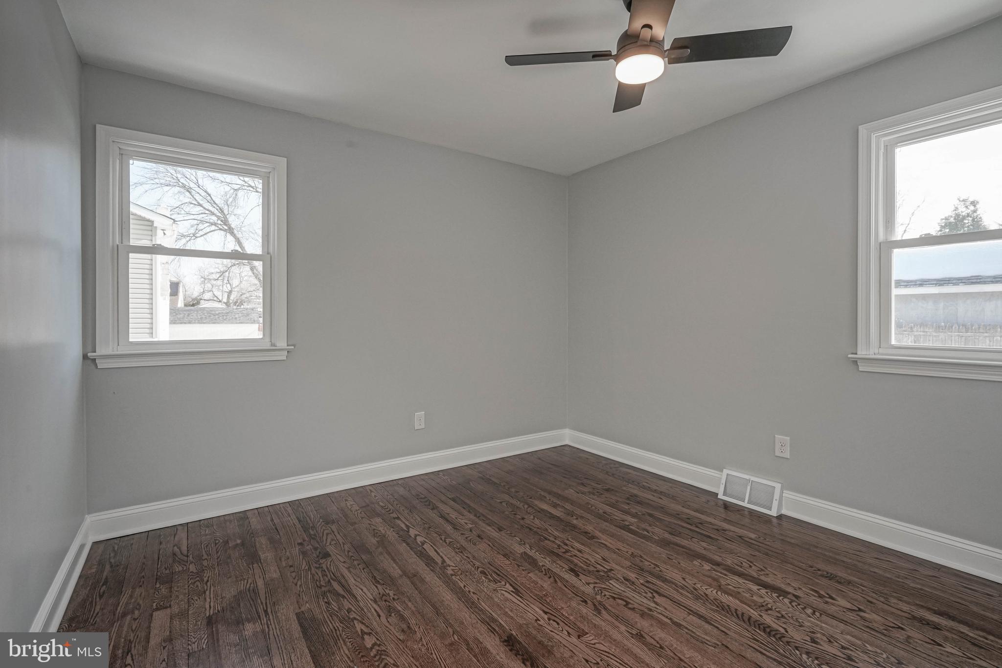 8 Riviera Drive Pennsville, NJ 08070 - Photo 23 of 31 wooden floor in an empty room with a window