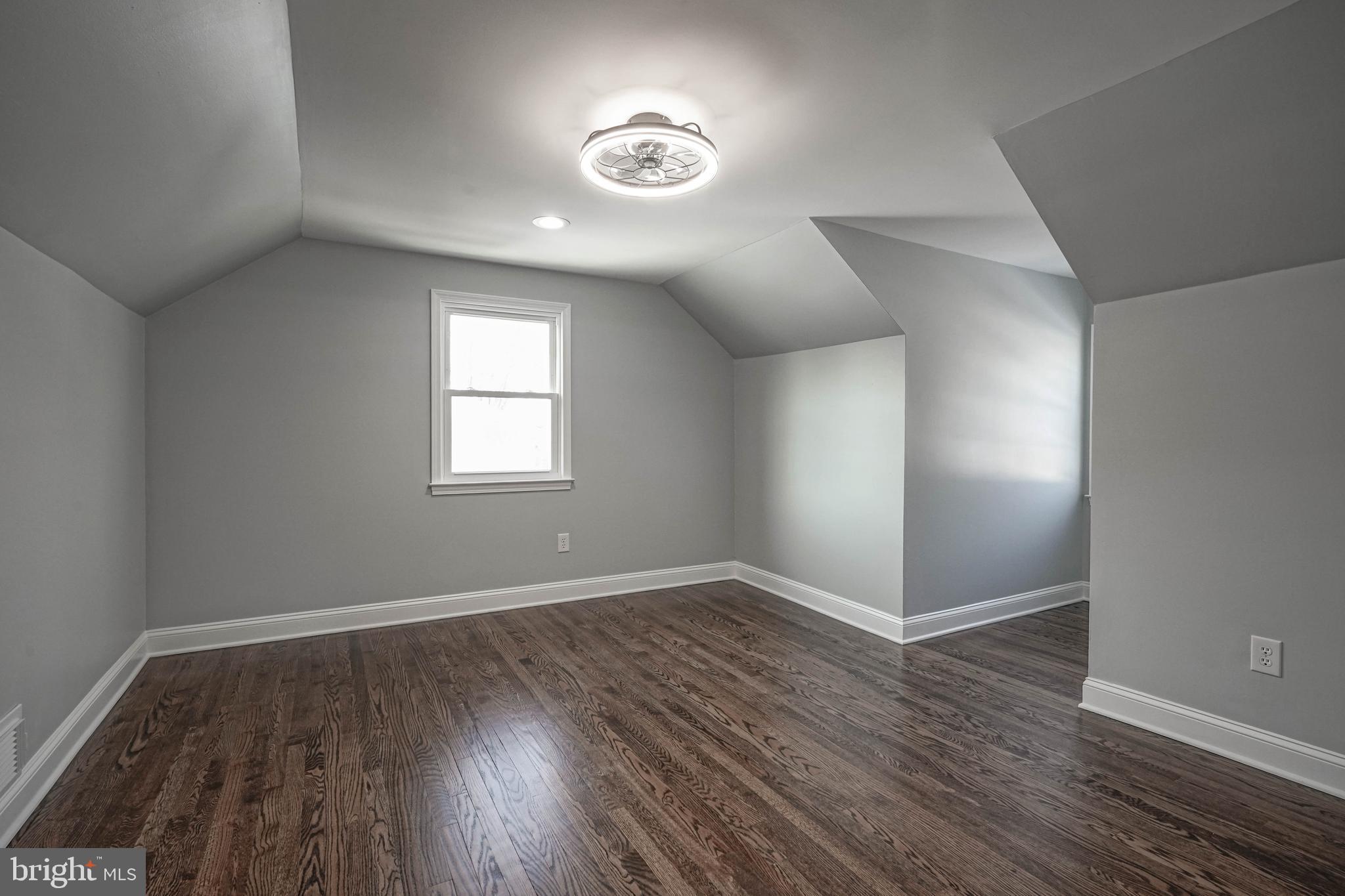 8 Riviera Drive Pennsville, NJ 08070 - Photo 25 of 31 an empty room with wooden floor and windows