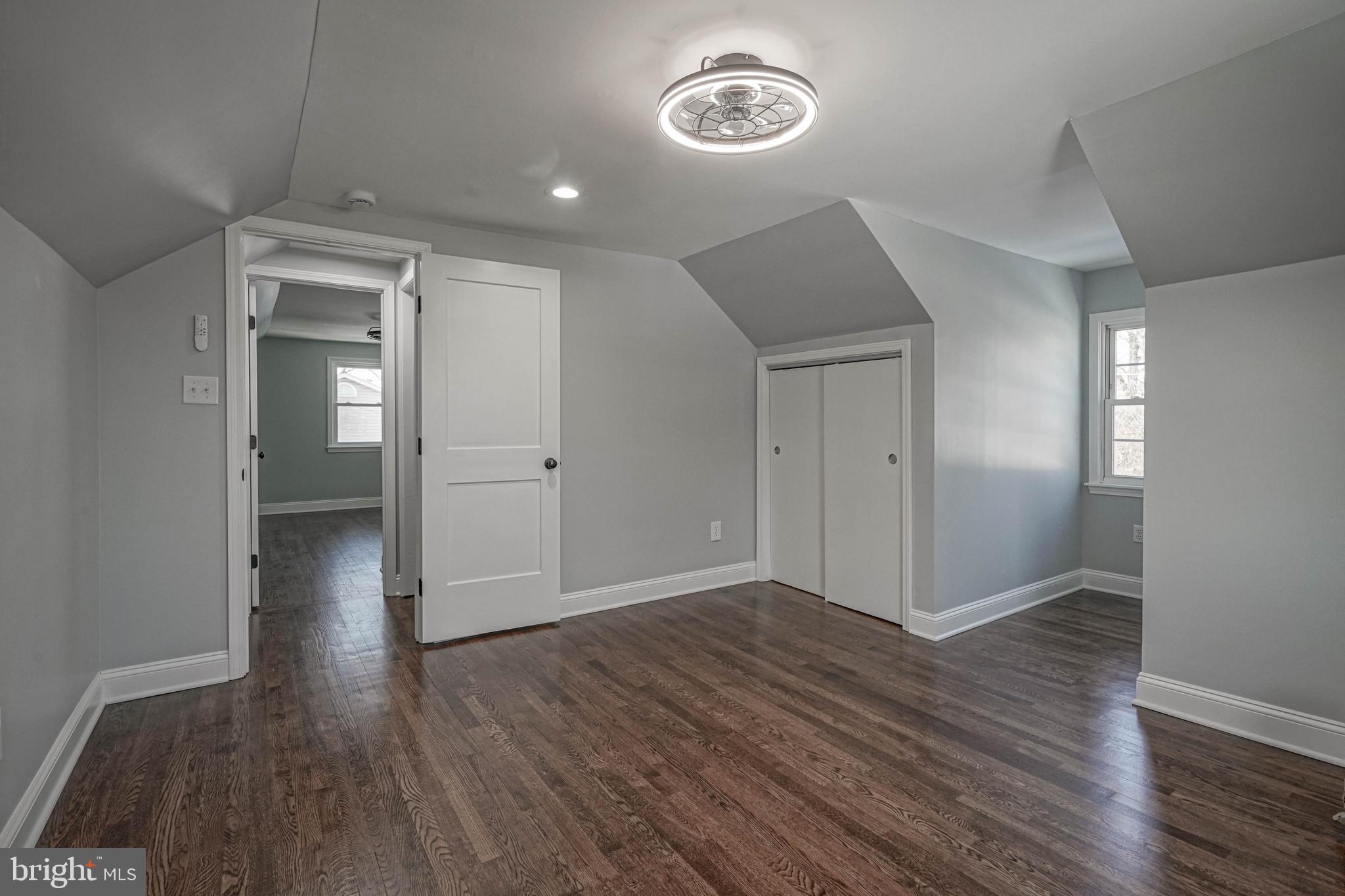 8 Riviera Drive Pennsville, NJ 08070 - Photo 28 of 31 an empty room with wooden floor and windows