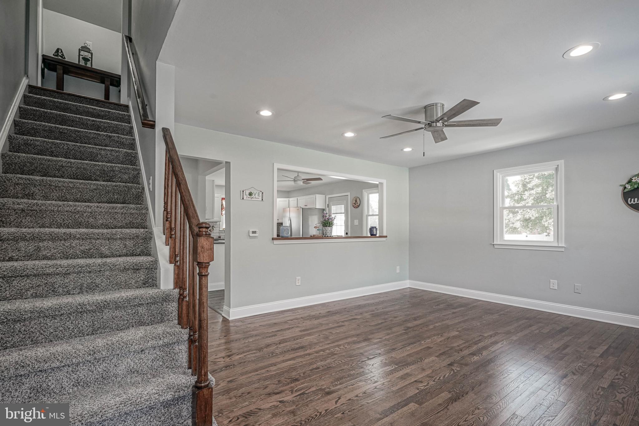8 Riviera Drive Pennsville, NJ 08070 - Photo 3 of 31 a view of an entryway with wooden floor and a ceiling fan