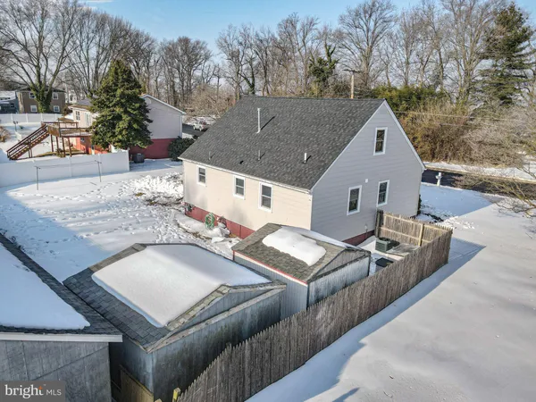a view of a house with snow on the road