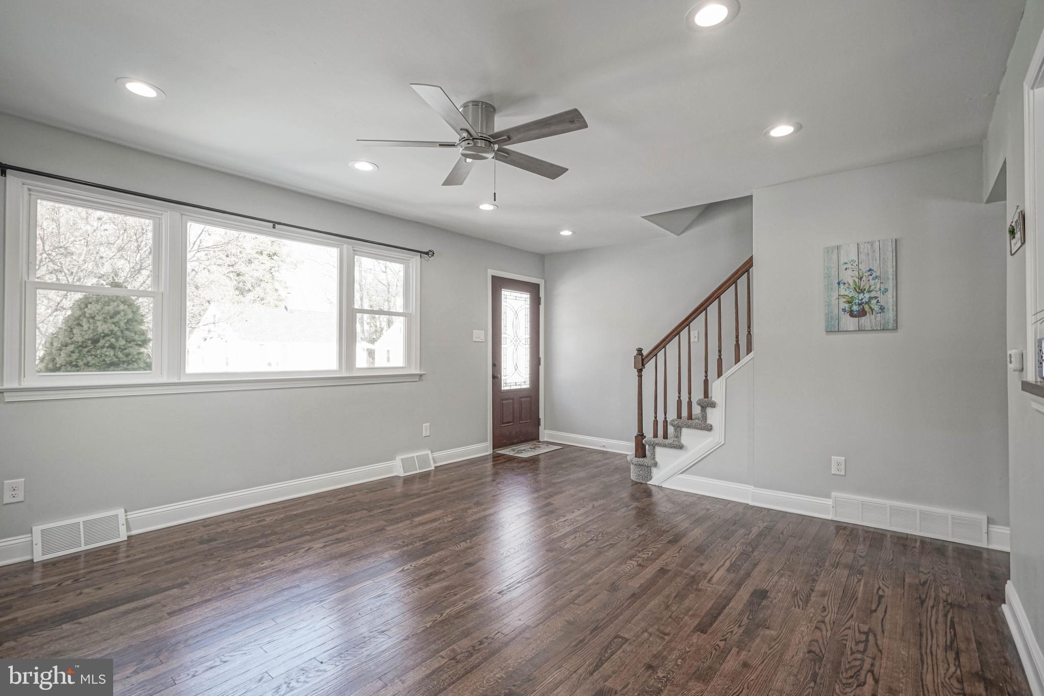 8 Riviera Drive Pennsville, NJ 08070 - Photo 7 of 31 a view of an empty room with wooden floor and a window