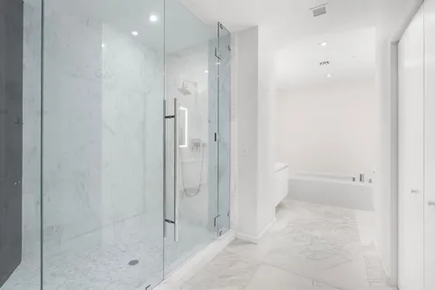 a view of hallway with wooden floor